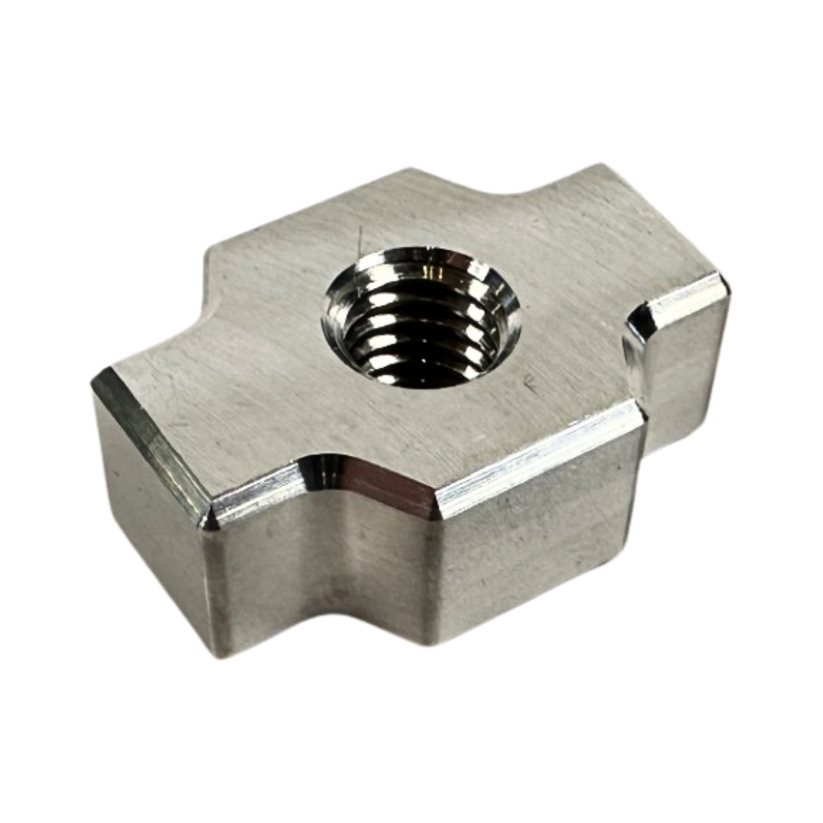 Metallic threaded nut with unique shape on white background.
