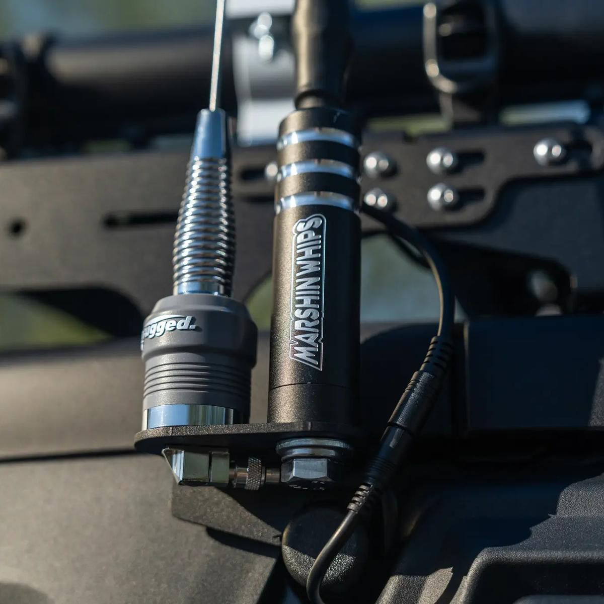 Vehicle communication antennas: Rugged and Marshin Whips mounted.