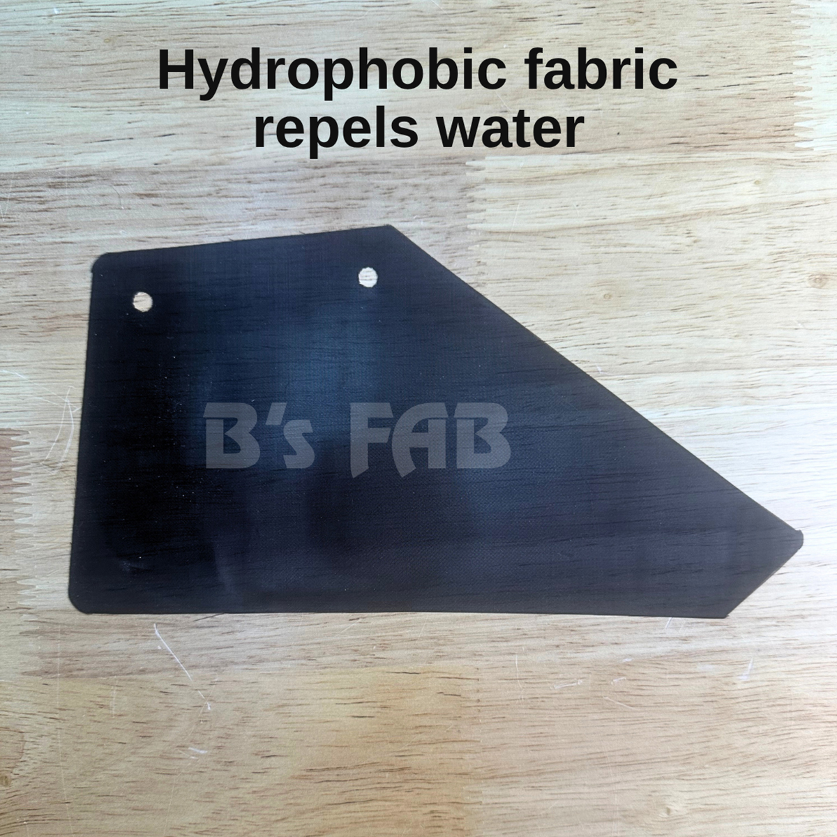 Black hydrophobic fabric swatch from B's FAB repels water.